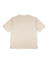 La VAQUERO VAQUERA Beige Tee, una camiseta lisa de manga corta, se presenta plana con la espalda hacia arriba sobre un fondo blanco, perfecta para looks unisex de estilo vaquero.